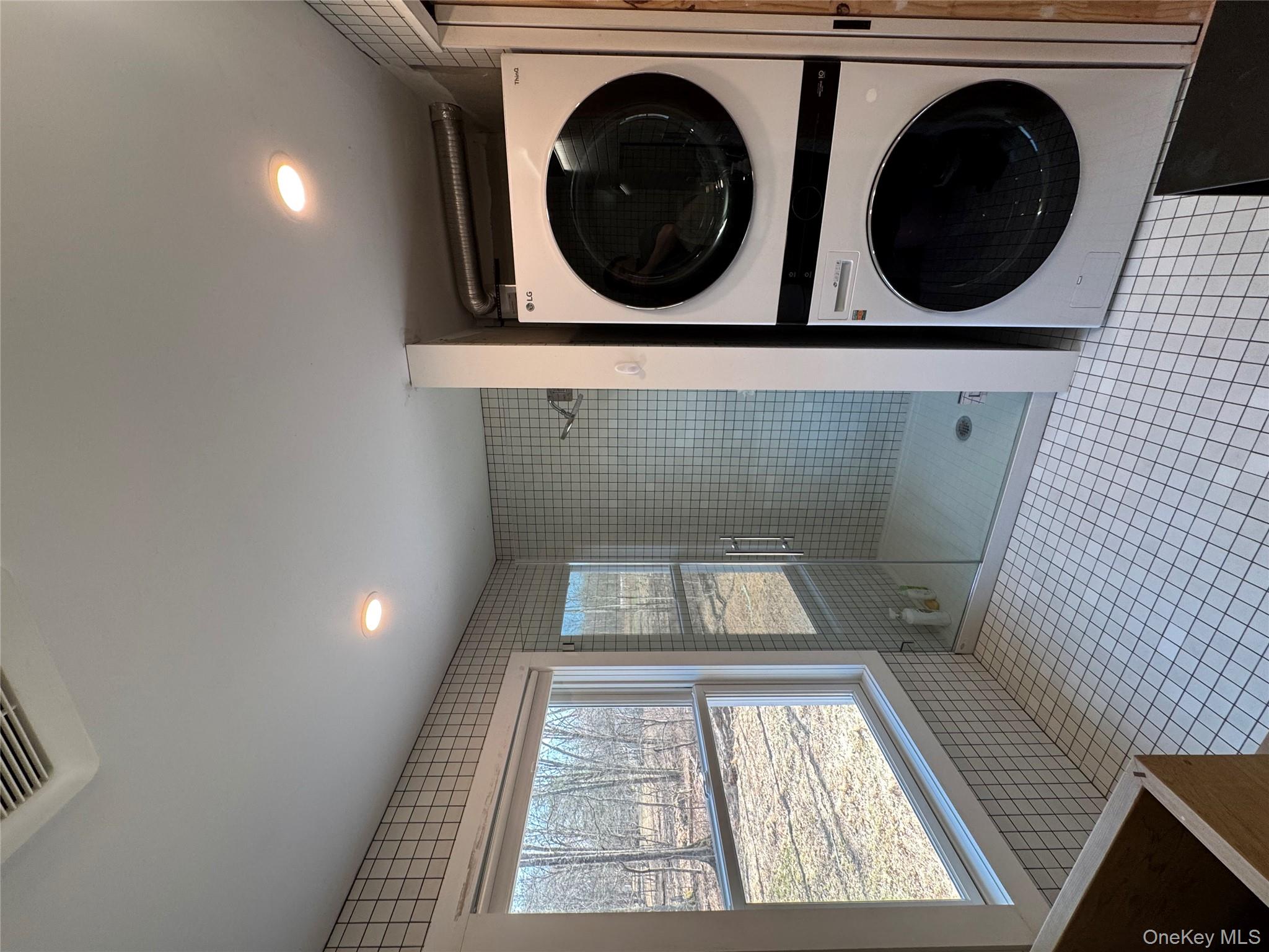 40 Pioneer Road Gardiner, NY 12525 - Photo 20 of 24 a view of a hallway with washer and dryer