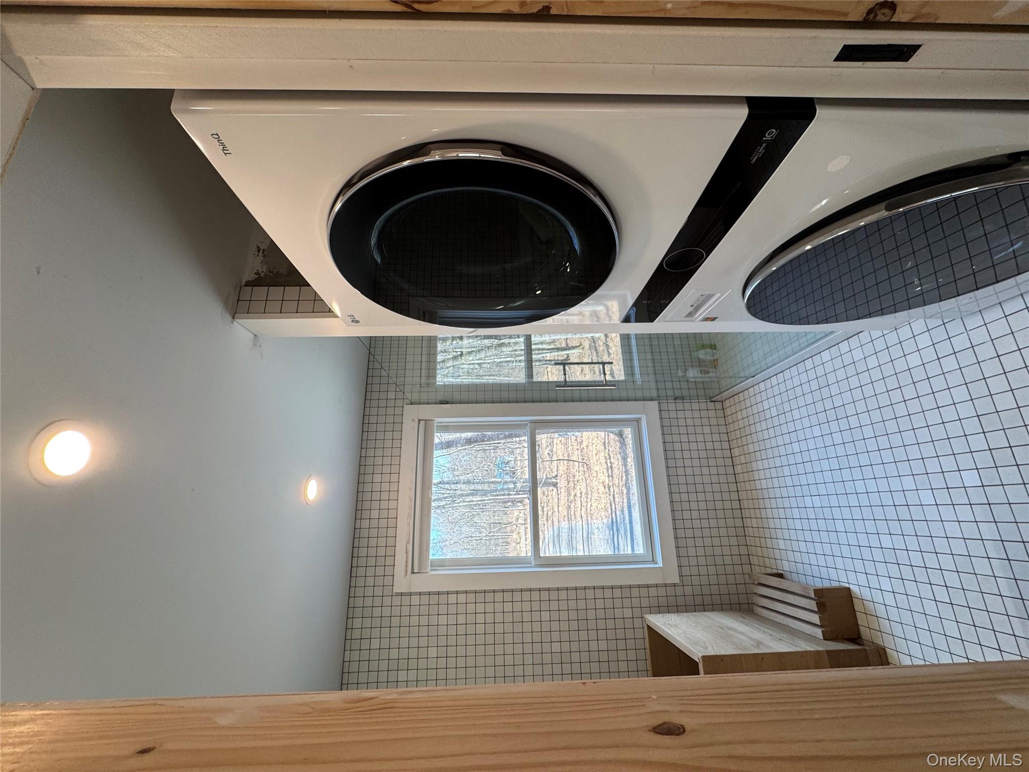 40 Pioneer Road Gardiner, NY 12525 - Photo 21 of 24 a view of a hallway with washer and dryer
