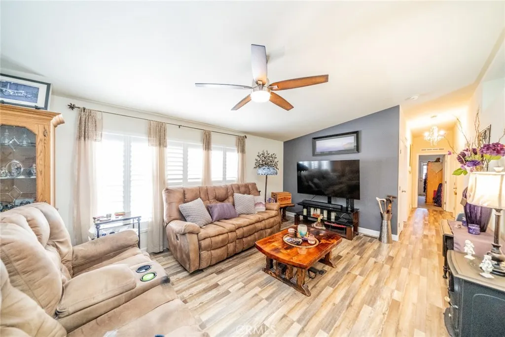 22241 Nisqually Road, Unit 153 Apple Valley, CA 92307 - Photo 14 of 55 a living room with furniture and a flat screen tv