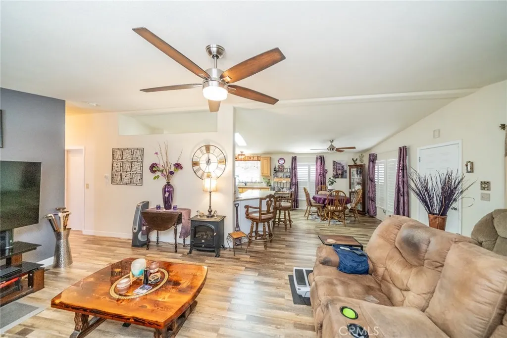 22241 Nisqually Road, Unit 153 Apple Valley, CA 92307 - Photo 17 of 55 a living room with furniture and wooden floor