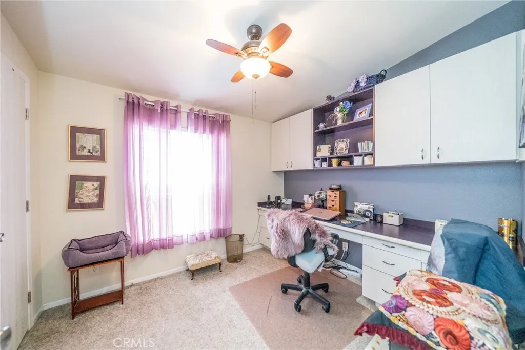 22241 Nisqually Road, Unit 153 Apple Valley, CA 92307 - Photo 25 of 55 a view of a workspace with a window and lounge chair