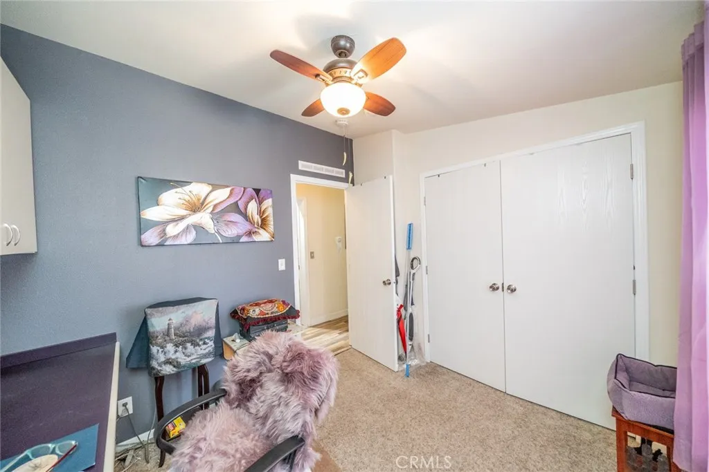 22241 Nisqually Road, Unit 153 Apple Valley, CA 92307 - Photo 27 of 55 a living room with furniture and decor