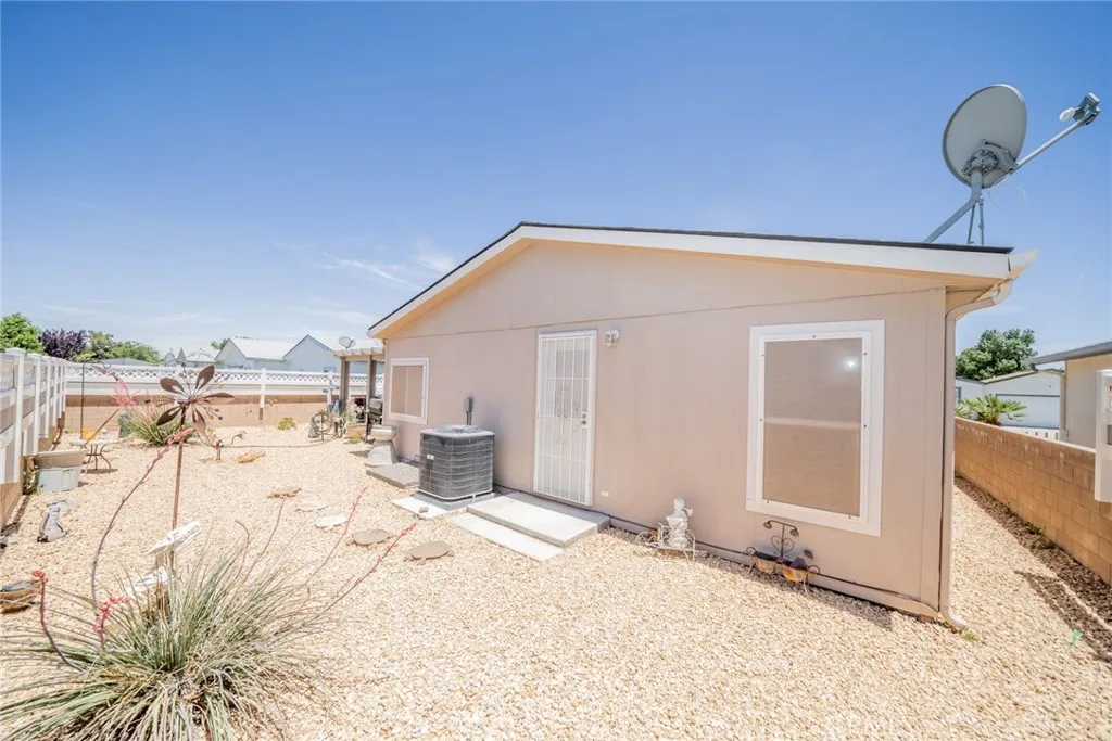 22241 Nisqually Road, Unit 153 Apple Valley, CA 92307 - Photo 35 of 55 a view of a house with a snow in the yard