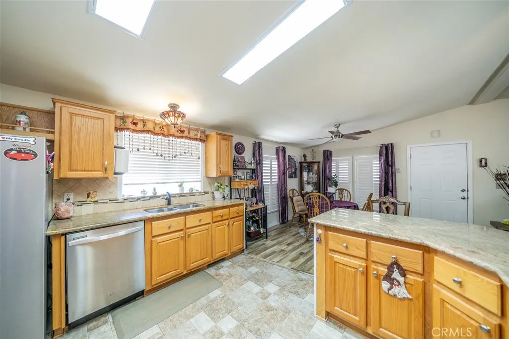 22241 Nisqually Road, Unit 153 Apple Valley, CA 92307 - Photo 9 of 55 a large bathroom with a granite countertop double vanity sink and a mirror