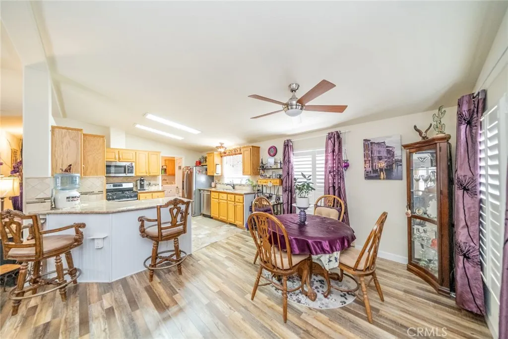 22241 Nisqually Road, Unit 153 Apple Valley, CA 92307 - Photo 10 of 55 a view of a dining room with furniture window and outside view