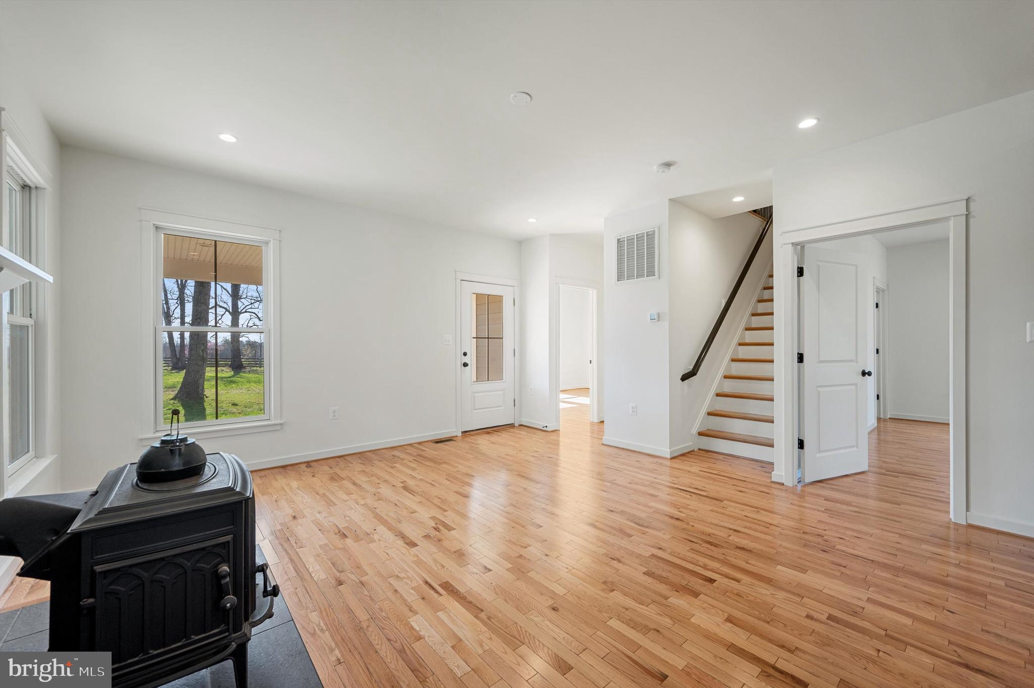 105 Loretto Drive Clear Brook, VA 22624 - Photo 15 of 65 a view of an empty room with wooden floor and stairs