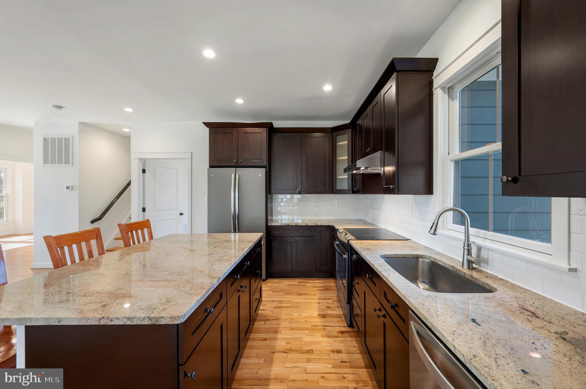 105 Loretto Drive Clear Brook, VA 22624 - Photo 17 of 65 a kitchen with stainless steel appliances granite countertop a sink a oven and a refrigerator