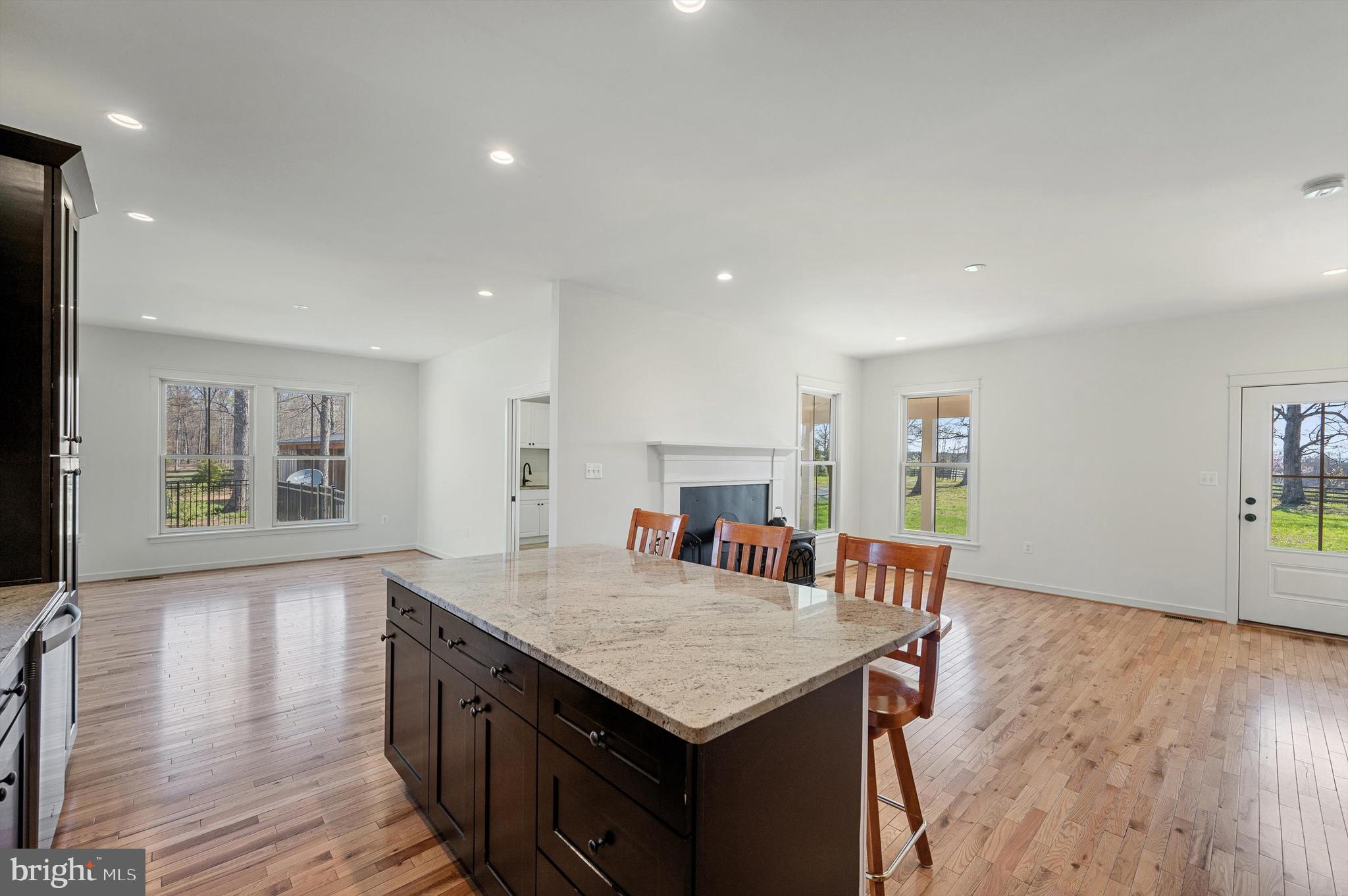 105 Loretto Drive Clear Brook, VA 22624 - Photo 18 of 65 a living room with stainless steel appliances granite countertop furniture wooden floor and a kitchen view