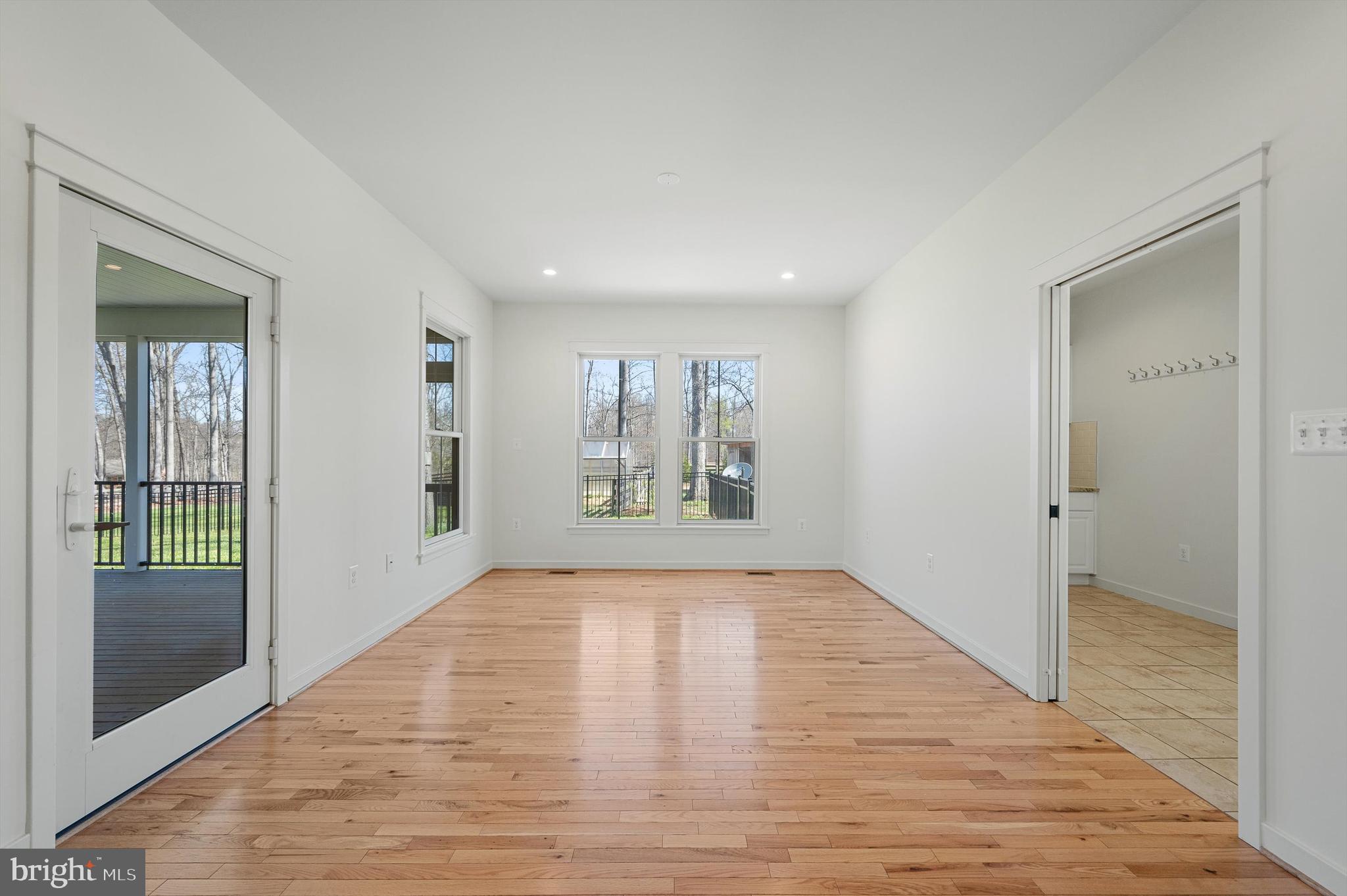105 Loretto Drive Clear Brook, VA 22624 - Photo 19 of 65 a view of an empty room with window and wooden floor