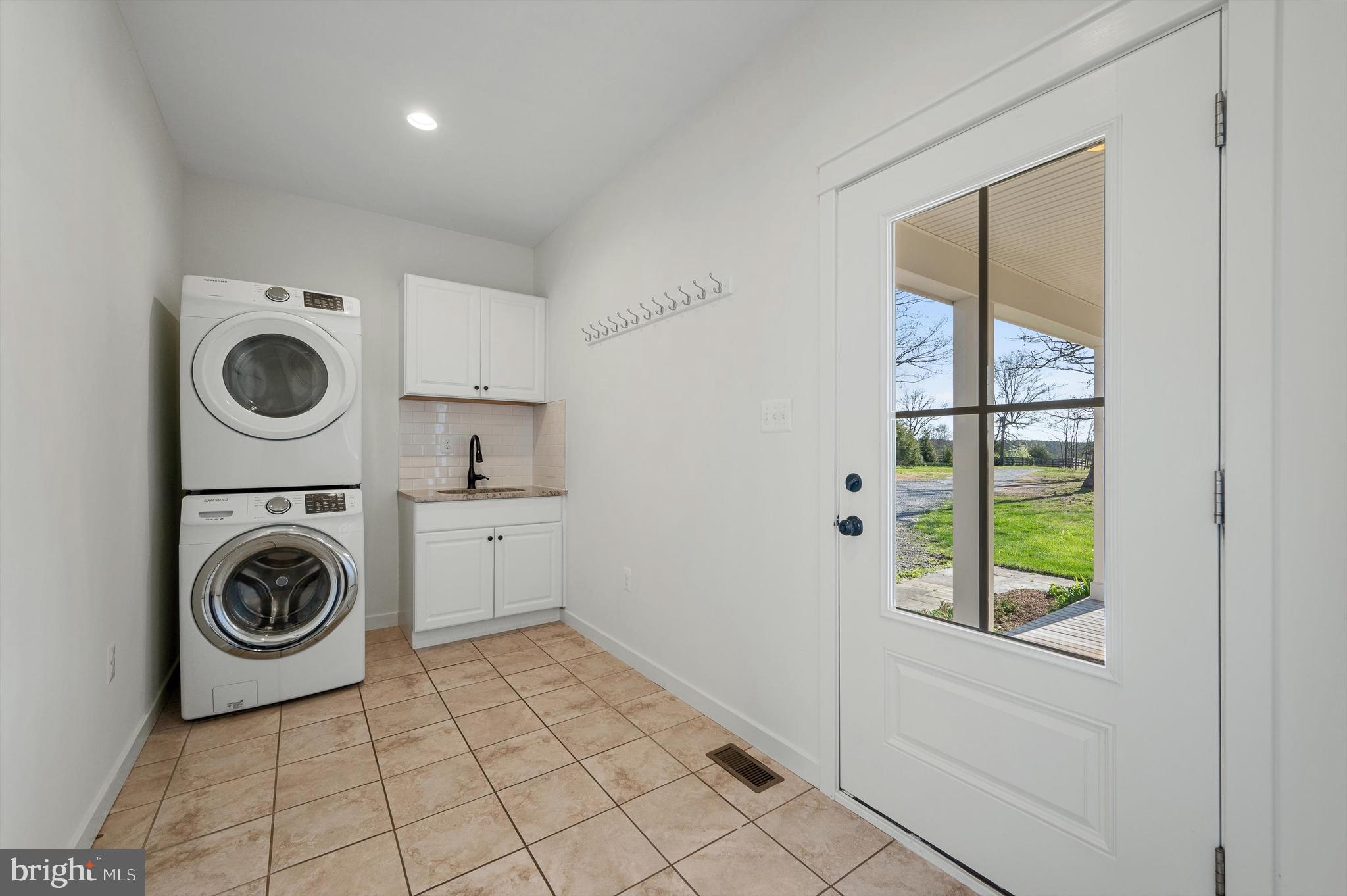 105 Loretto Drive Clear Brook, VA 22624 - Photo 21 of 65 a utility room with sink dryer and washer