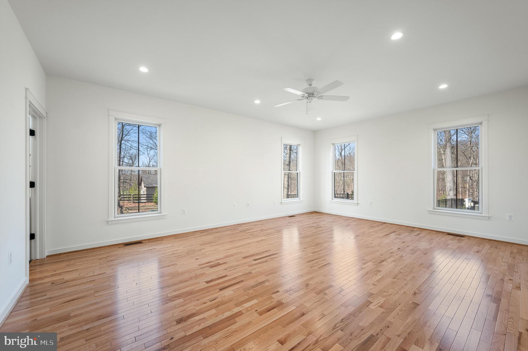 105 Loretto Drive Clear Brook, VA 22624 - Photo 26 of 65 a view of an empty room with wooden floor and a window