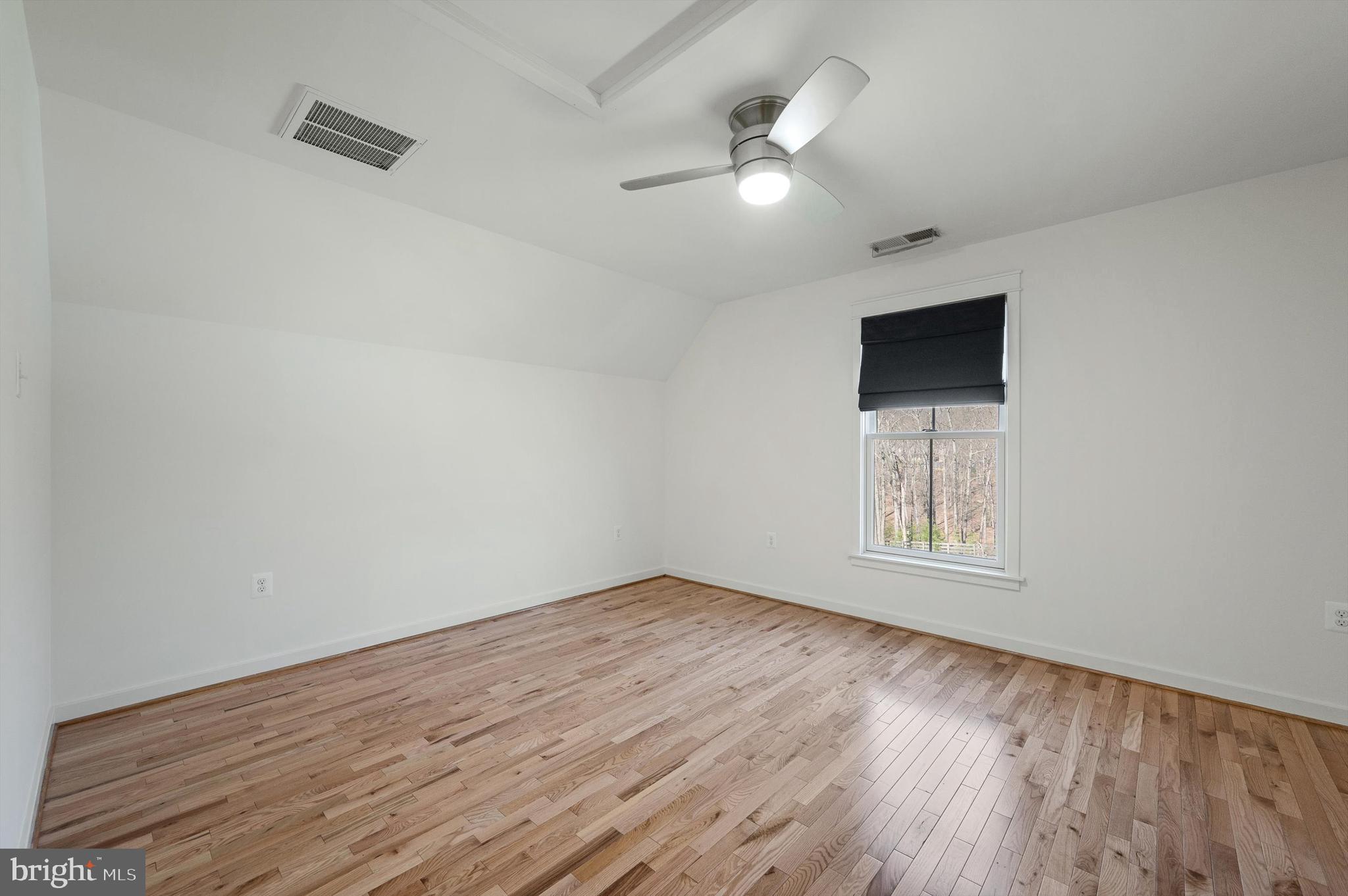 105 Loretto Drive Clear Brook, VA 22624 - Photo 41 of 65 an empty room with wooden floor and windows