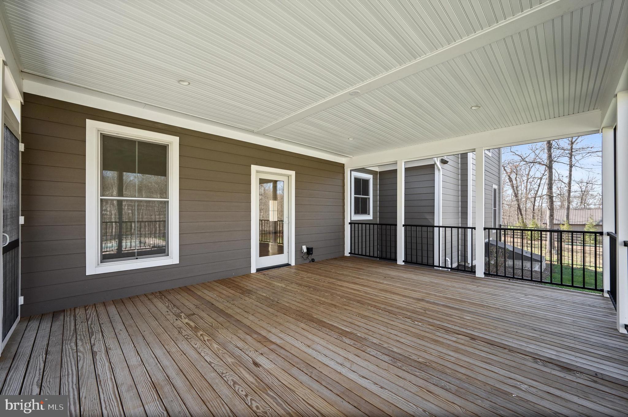 105 Loretto Drive Clear Brook, VA 22624 - Photo 44 of 65 a view of an empty room with wooden floor and balcony