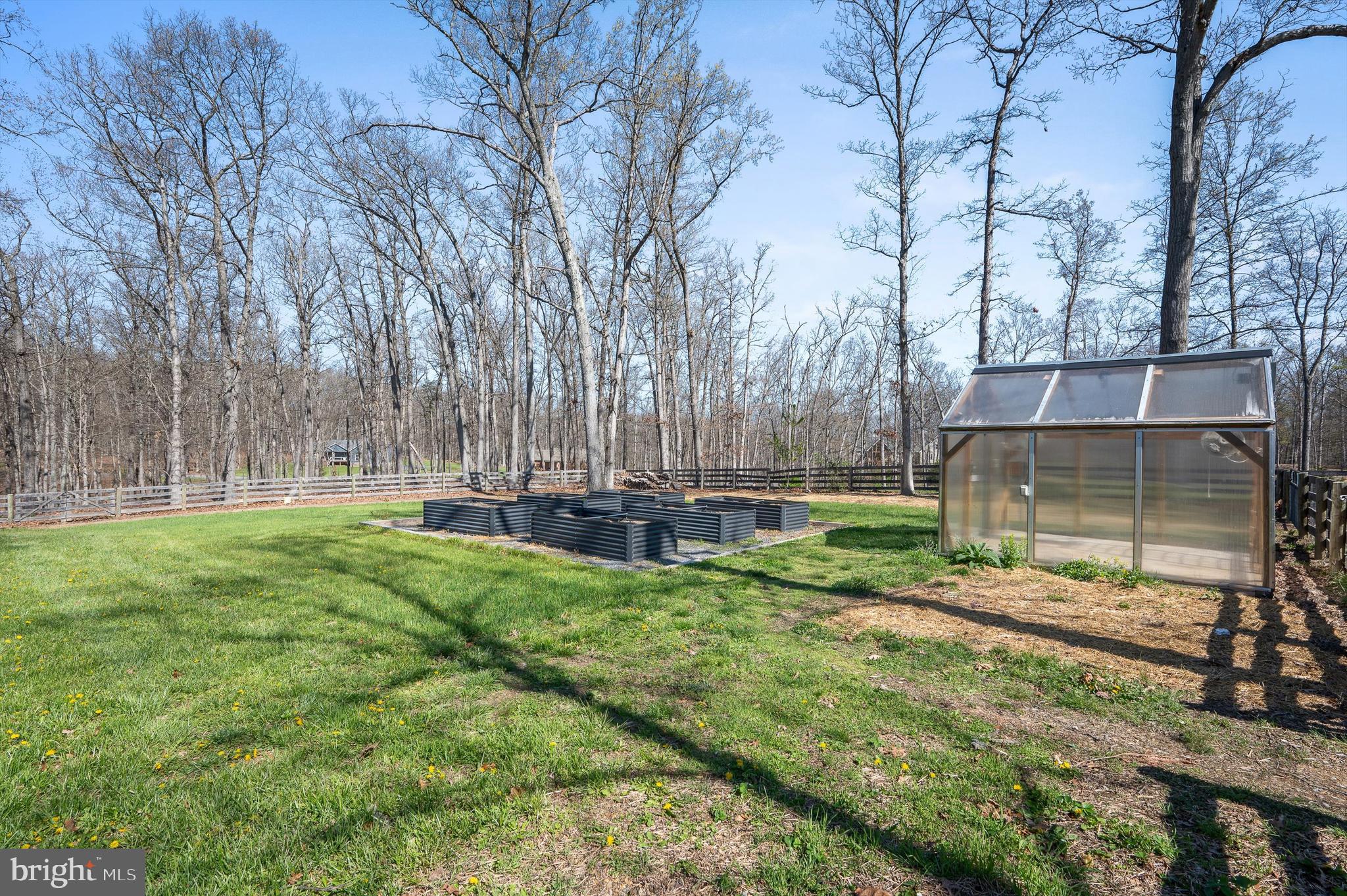 105 Loretto Drive Clear Brook, VA 22624 - Photo 50 of 65 a view of backyard with wooden fence and a large tree