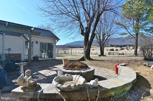 a large kitchen with a table and chairs in it