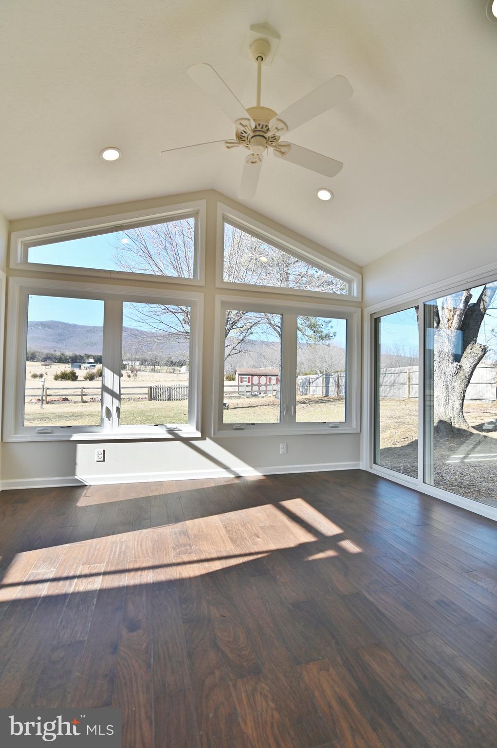 8289 Back Road Maurertown, VA 22644 - Photo 23 of 59 a view of an empty room with wooden floor and a window