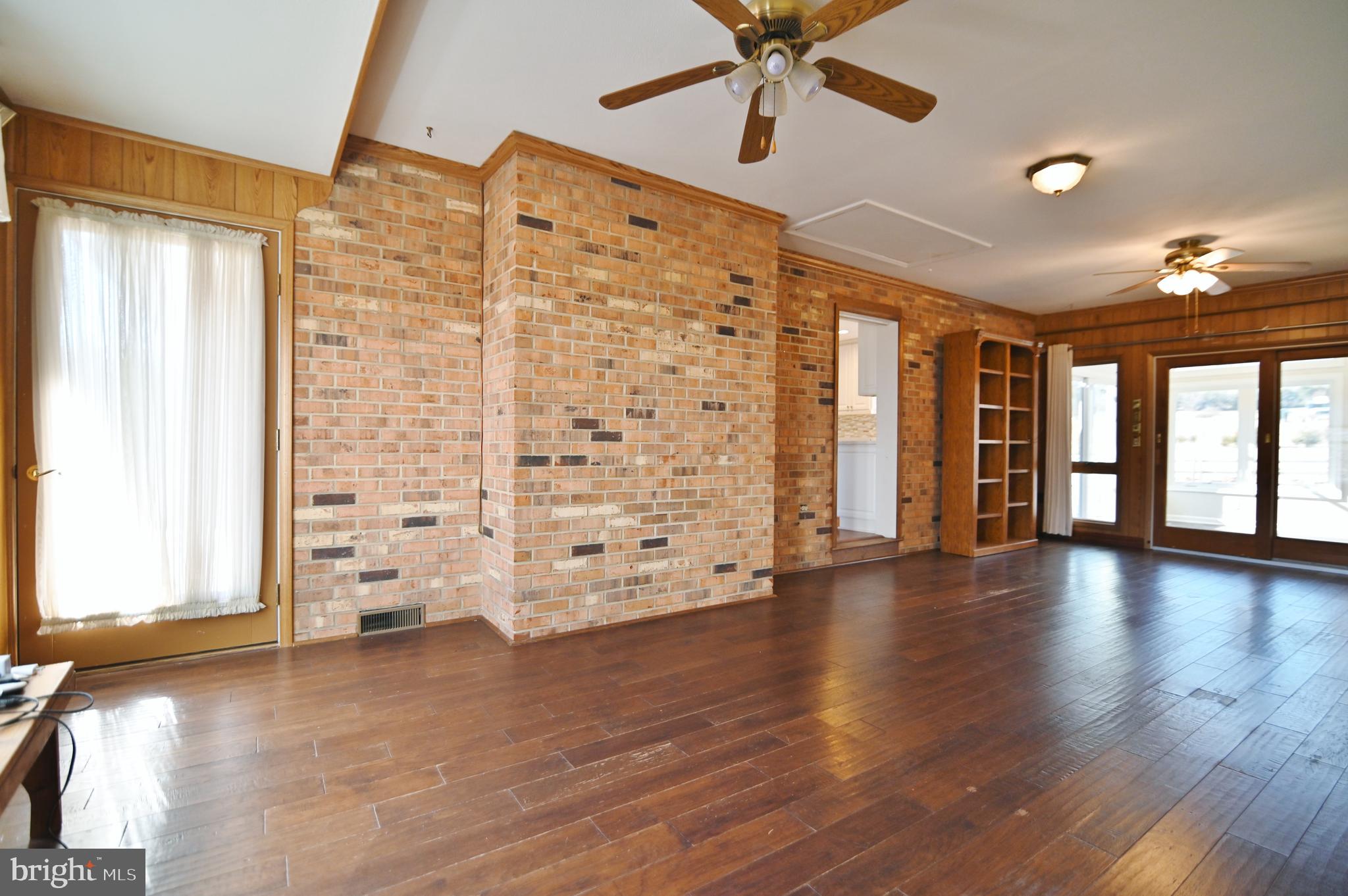 8289 Back Road Maurertown, VA 22644 - Photo 35 of 59 a view of an empty room with wooden floor and a window