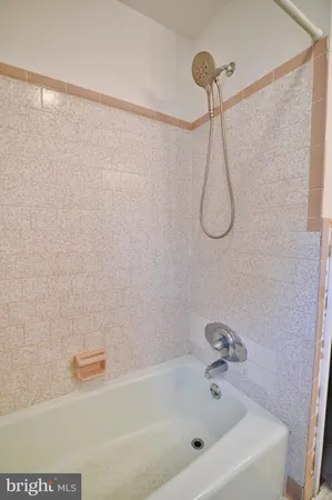 a view of a bathroom with mirror