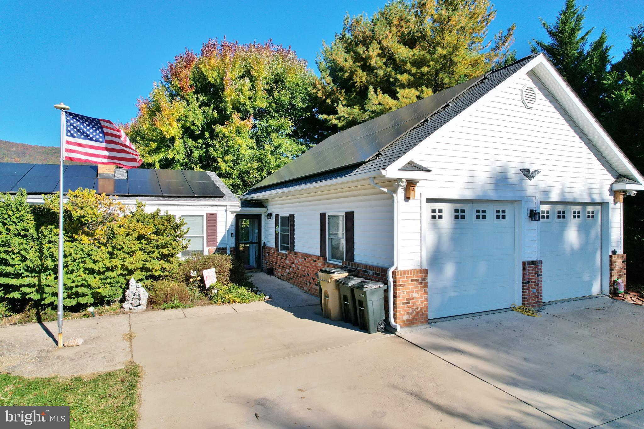 8289 Back Road Maurertown, VA 22644 - Photo 5 of 59 a view of a house with a patio