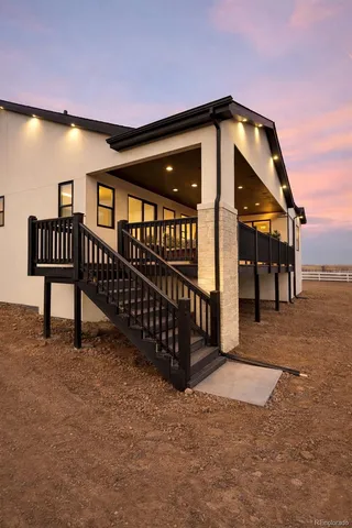 a view of a house with large windows