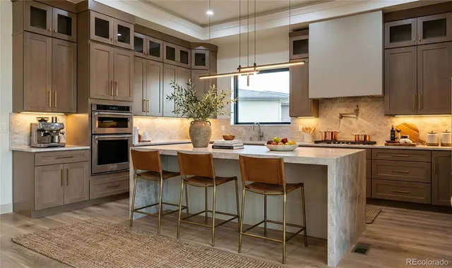 a kitchen with a sink cabinets and stainless steel appliances