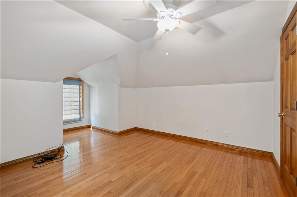 166 Main Street Star Junction, PA 15482 - Photo 28 of 50 an empty room with wooden floor and windows