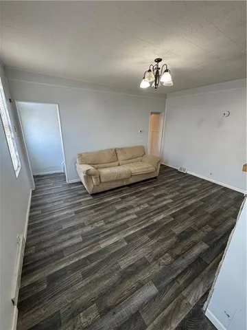 a living room with hard wood floors