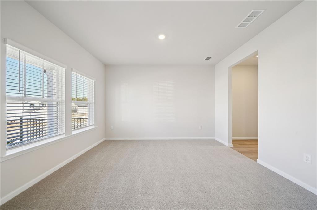 391 Tallulah Lane Grayson, GA 30017 - Photo 13 of 35 a view of an empty room with a window