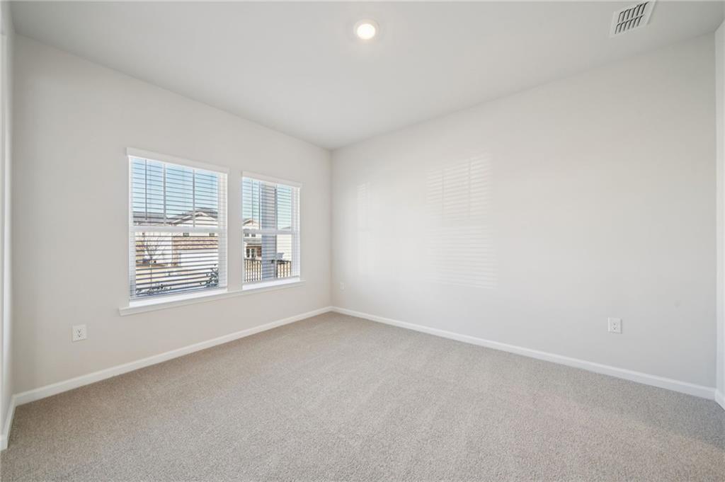 391 Tallulah Lane Grayson, GA 30017 - Photo 14 of 35 an empty room with a window