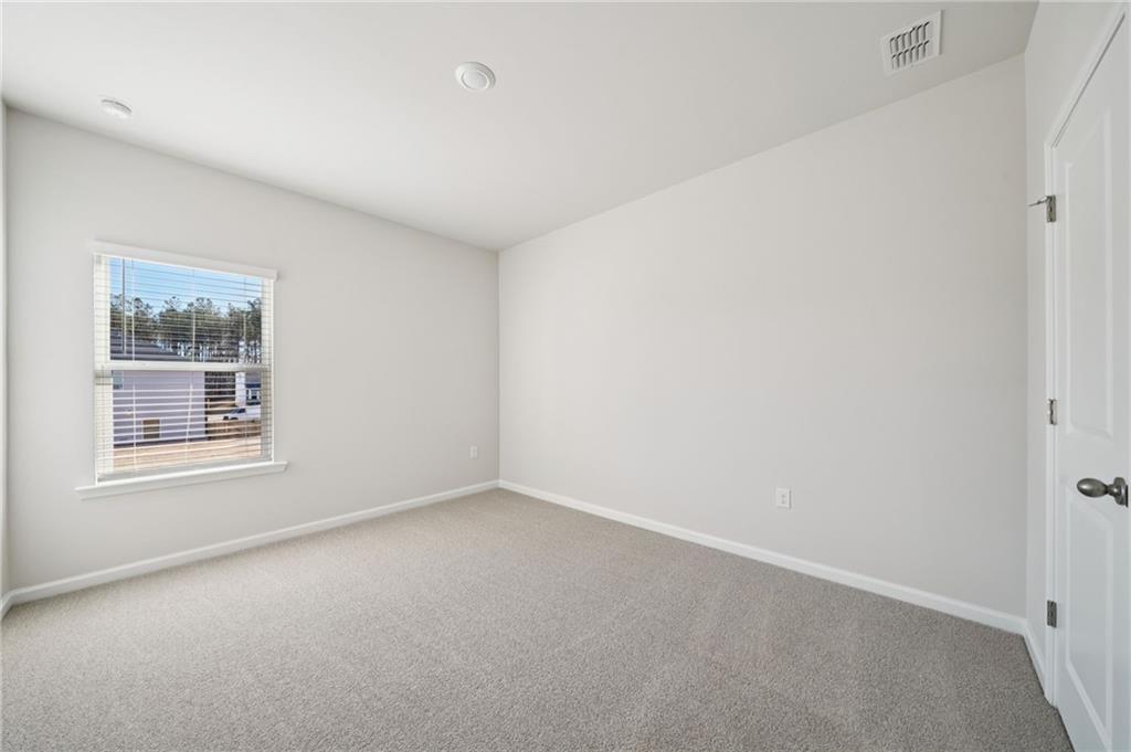 391 Tallulah Lane Grayson, GA 30017 - Photo 15 of 35 an empty room with a window