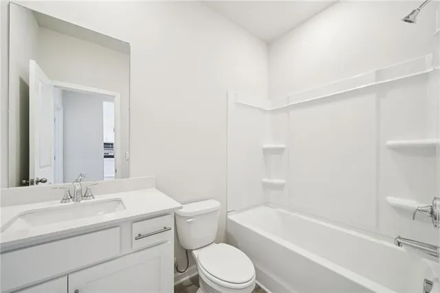 a bathroom with a toilet a sink and a bathtub