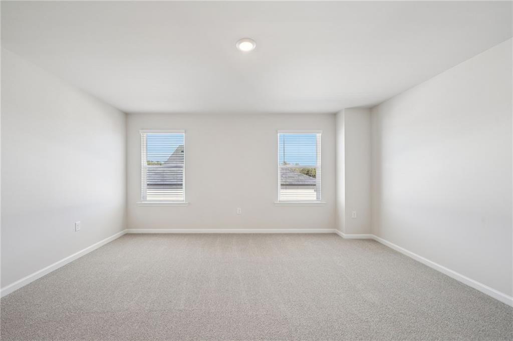 391 Tallulah Lane Grayson, GA 30017 - Photo 18 of 35 an empty room with windows