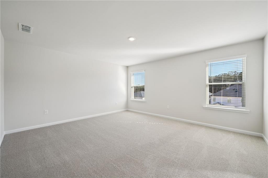 391 Tallulah Lane Grayson, GA 30017 - Photo 19 of 35 an empty room with windows