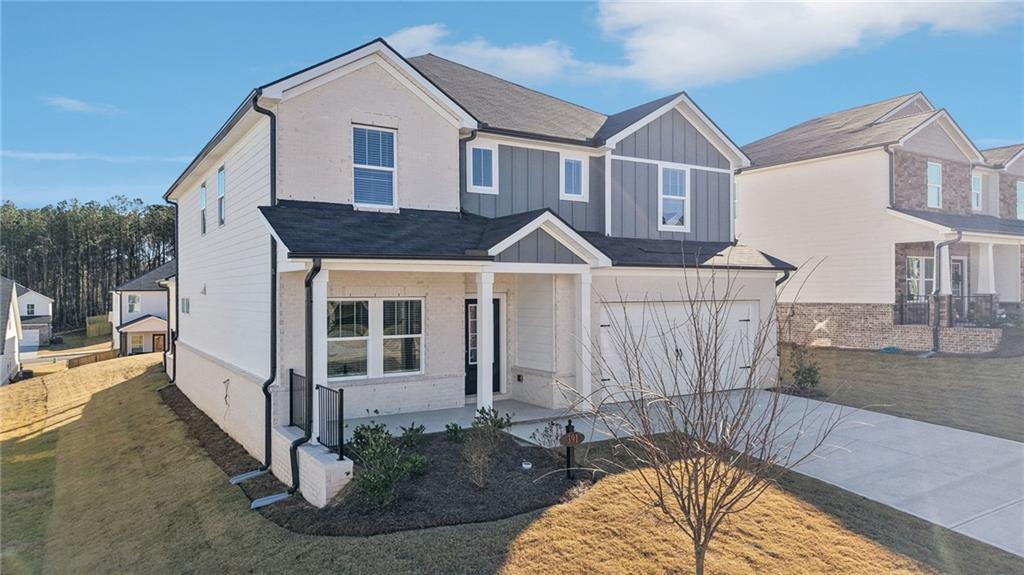 391 Tallulah Lane Grayson, GA 30017 - Photo 2 of 35 a front view of a house with garden