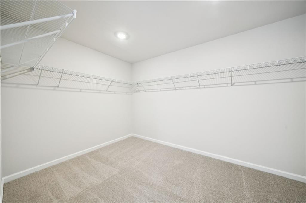 391 Tallulah Lane Grayson, GA 30017 - Photo 24 of 35 a view of a room with racks on the wall