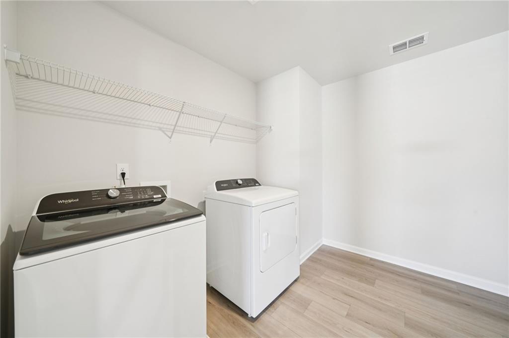 391 Tallulah Lane Grayson, GA 30017 - Photo 25 of 35 a utility room with dryer and washer