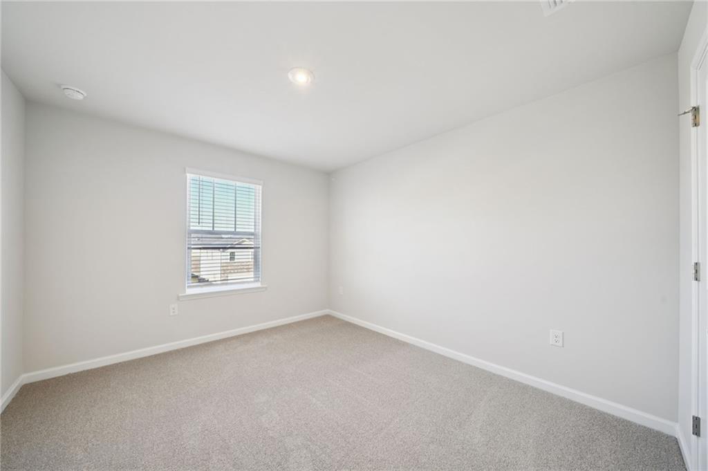 391 Tallulah Lane Grayson, GA 30017 - Photo 26 of 35 an empty room with a window