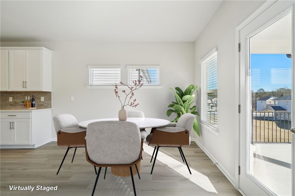 391 Tallulah Lane Grayson, GA 30017 - Photo 8 of 35 a view of a livingroom with furniture and a potted plant