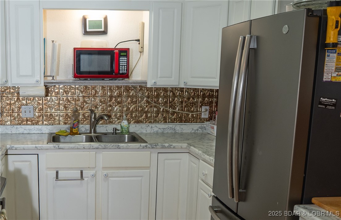 1070 Old Nonsuch Road Camdenton, MO 65020 - Photo 20 of 46 Samsung side-side fridge with freezer drawer