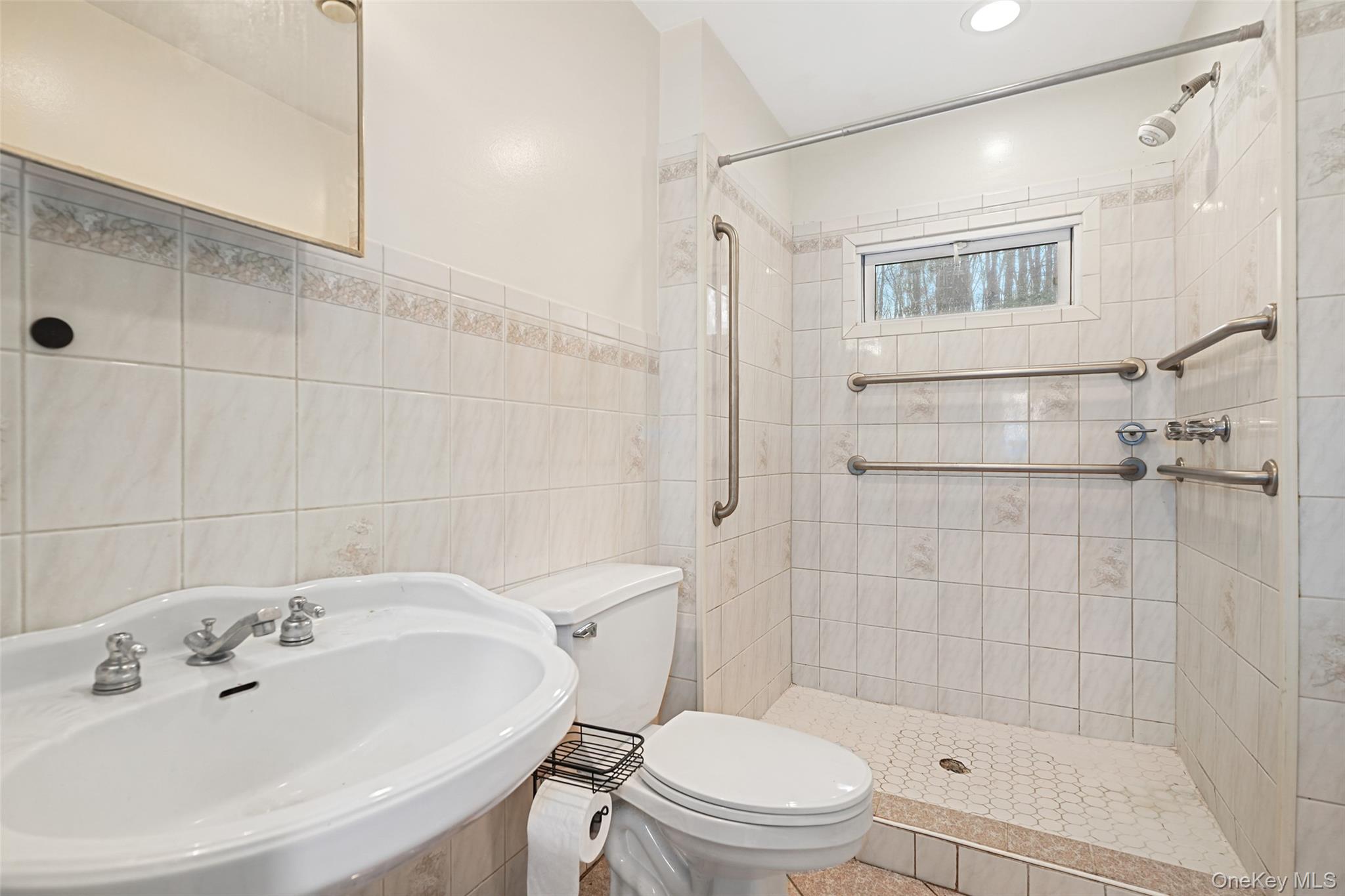 22 Raspberry Lane Carmel, NY 10512 - Photo 15 of 23 a bathroom with a sink toilet and shower