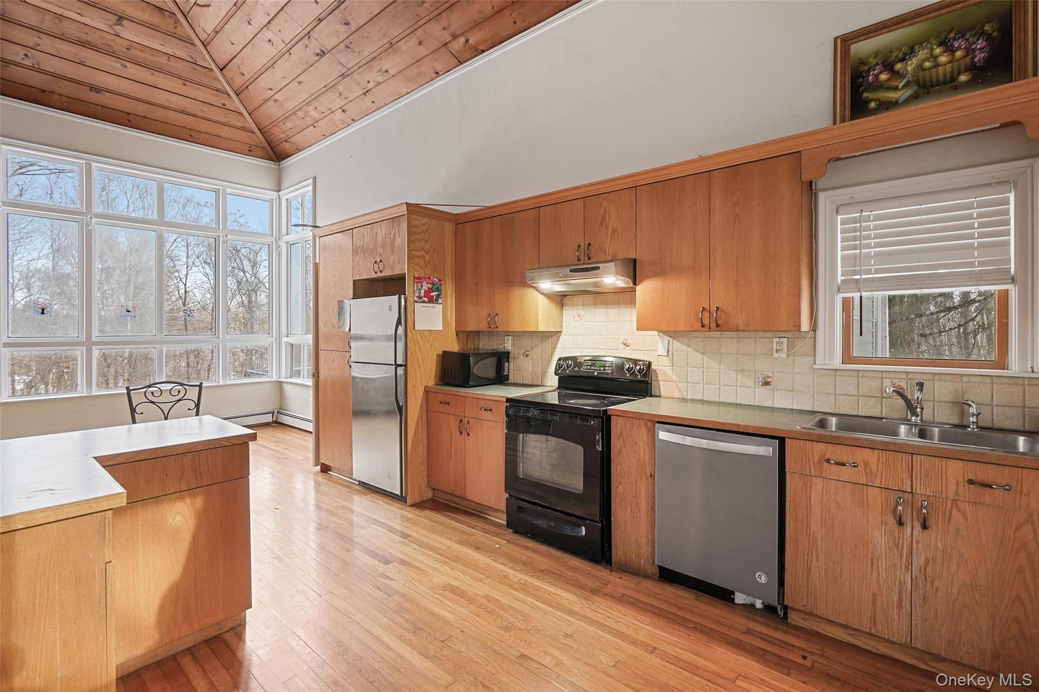 22 Raspberry Lane Carmel, NY 10512 - Photo 17 of 23 a kitchen with stainless steel appliances granite countertop a sink stove and refrigerator