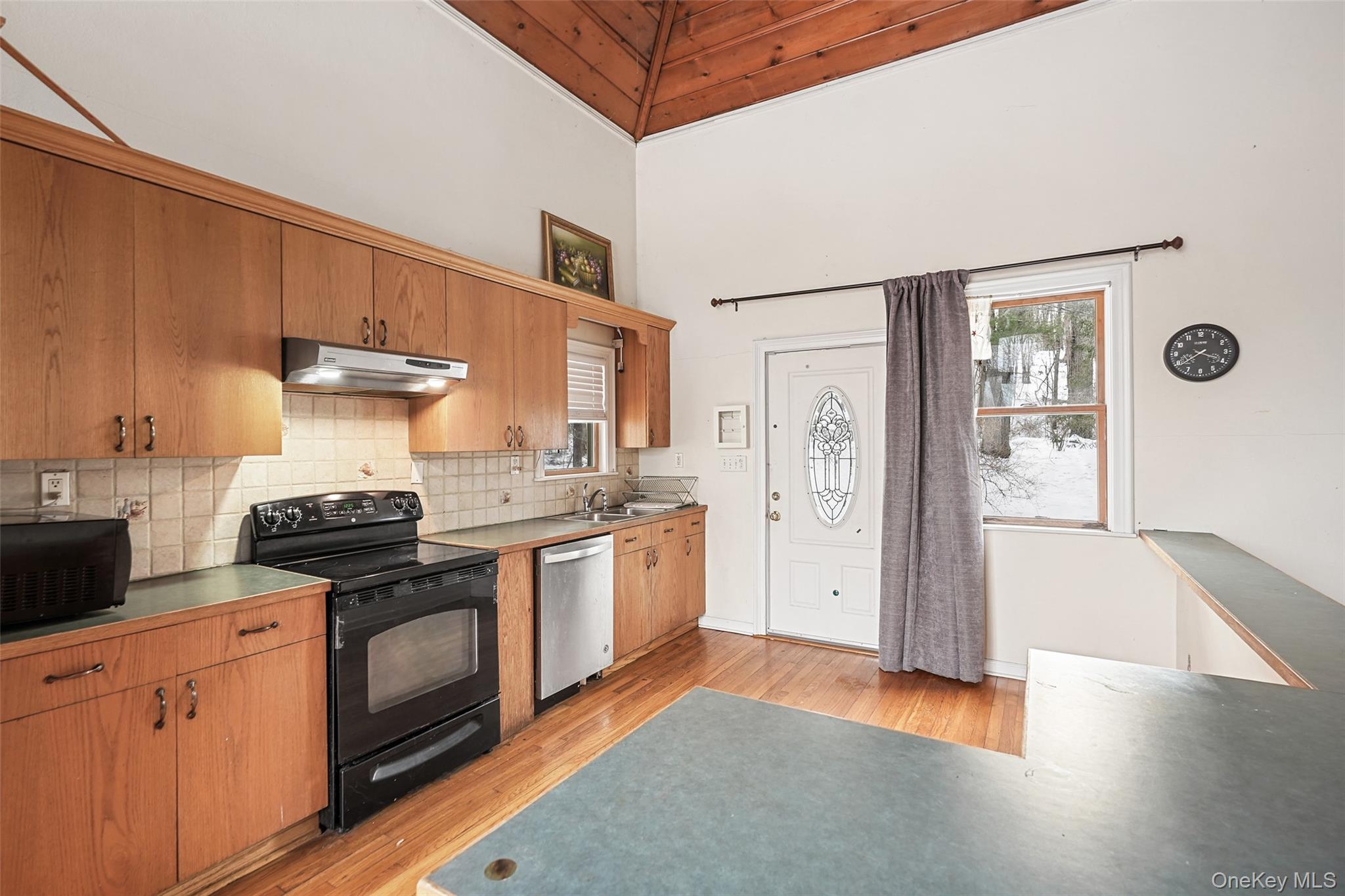 22 Raspberry Lane Carmel, NY 10512 - Photo 3 of 23 a kitchen with stainless steel appliances granite countertop a stove and a refrigerator