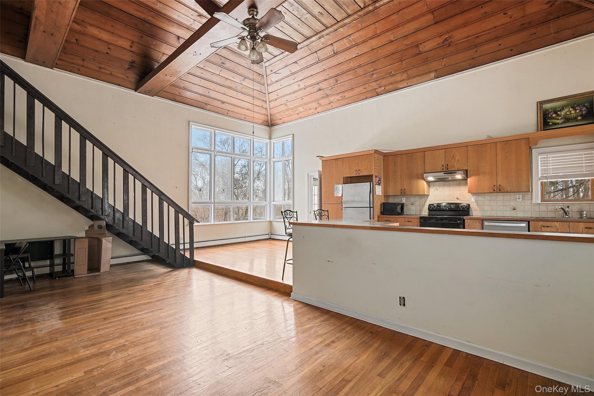22 Raspberry Lane Carmel, NY 10512 - Photo 8 of 23 a kitchen with stainless steel appliances granite countertop a refrigerator a sink a stove and a wooden floors