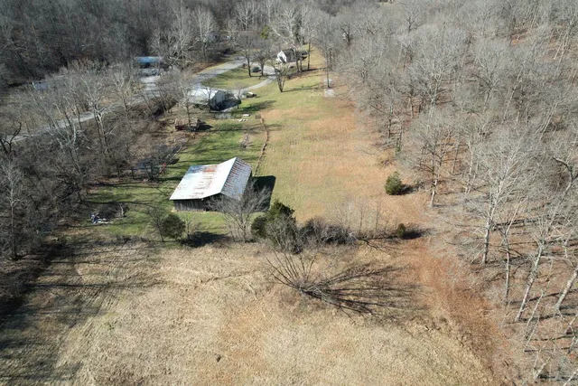 a kitchen with stainless steel appliances a stove a sink and a refrigerator