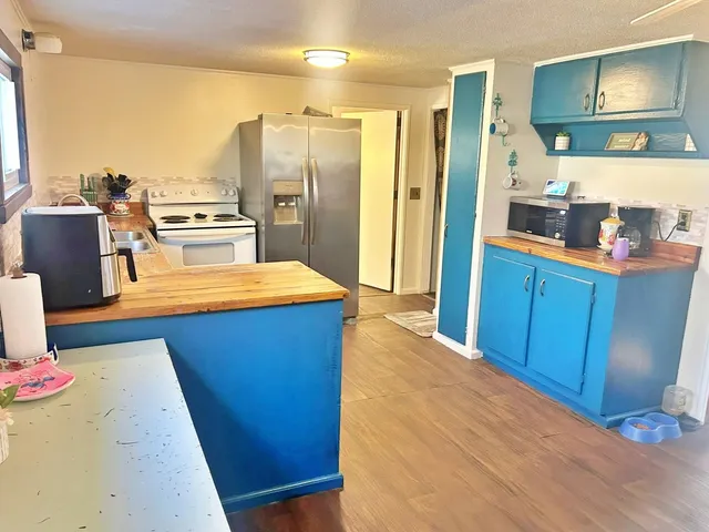 a living room with furniture and a baby crib
