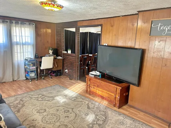 a bedroom with a bed and a table