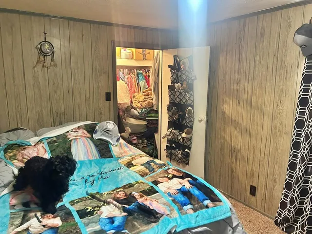 a bedroom with a bed and a shower