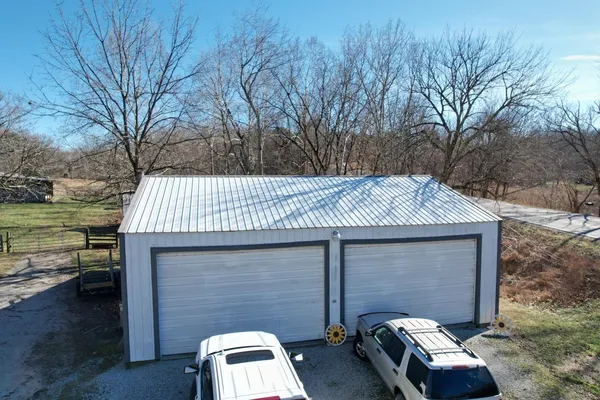 a view of a dry yard with mountains in the background
