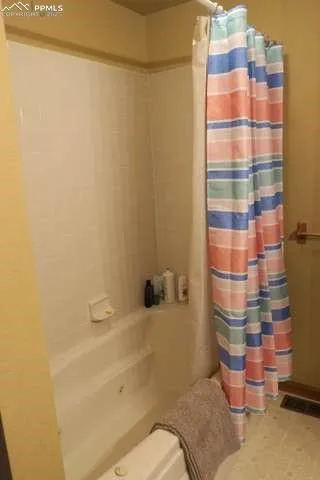 a bathroom with a sink and a shower