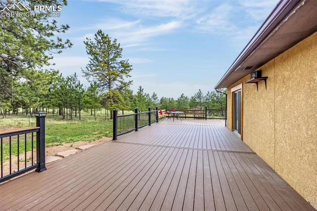 a view of a patio with wooden floor